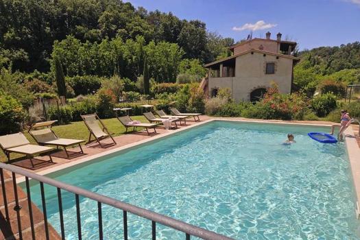 Family-friendly apartments in a holiday home with a pool in Volterra